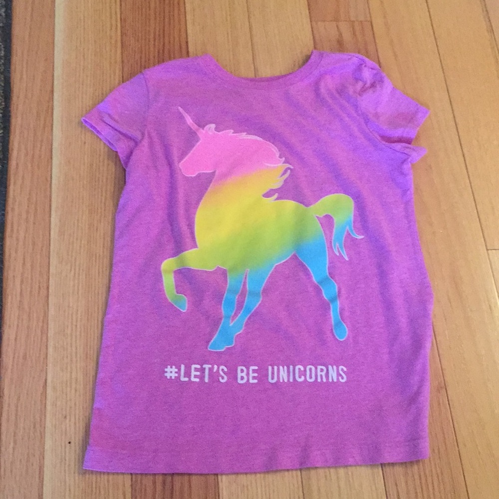 a purple unicorn shirt